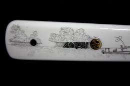A Filet KnifeThis is a filet knife id did as a Christmas present for my oldest son.  The blade is Norwegian steel and the scales are white Corian. The image is that of a flats fisherman and approaching thunderheads; a scene common here on the west coast of Florida.