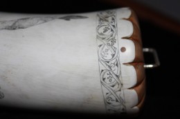 Engraved band around the baseAround the base of the horn I engraved a ½ inch wide band with scrollwork of climbing rose vines.