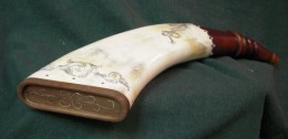 A Flat HornThe is the first flat horn I ever made.  I made it as the ladies aggregate shooting prize at a rendezvous in 2008.  The butt plug is walnut which I “trayed” and then inlaid silver wire.  I considerd this a “learning” horn.