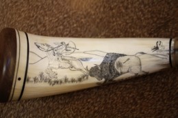 CloserI originally wanted to put this image on the outside of the horn and had prepared to scrimshaw it there.  I was about halfway finished with the horses face when I hit a soft spot in the horn and a large flake popped out leaving a hole which when inked looked like the horse had been gored in the face or had half his nose hot off…not the look I was going for.   I sanded that work away turned the horn over and put the image on the inside curve.