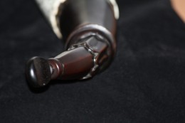 The Coplin Horn - Throat Detail Neck & SpoutThe throat was cut down and flows into two rings where the strap will attach. It then steps down to a fluted collar and finally to a faceted spout. I used an ebony fiddle peg for a stopper.