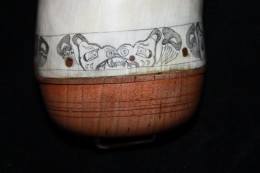 The Hallo Bay HornThe engraving around the base is inspired by a bear totem used in Native American art. Note the bear claws.