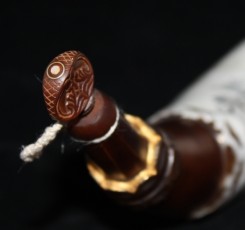Spout and Plug Spout and PlugThe spout is faceted and plugged with a carved and inlaid fiddle peg, dyed to match the horn.