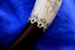 At the throat of the horn, I've engrailled the edge and then added some engraved flourishes.  Although the engraving is small, there were lots of elements so it took a while to do.
